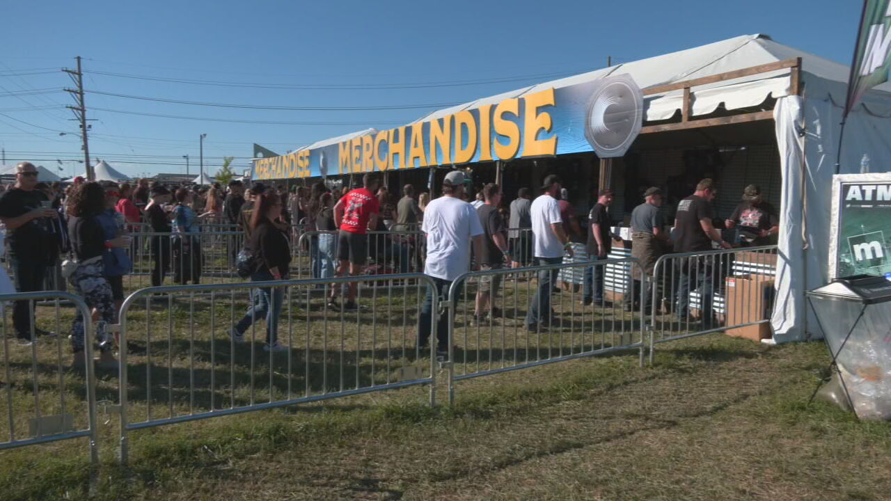 Louder Than Life fans near merchandise tents on first day of festival